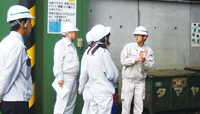 Image : Employee of Hamamatsu Plant inspecting a waste disposal site
